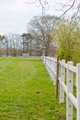 Fototapeta na wymiar white fence in the park