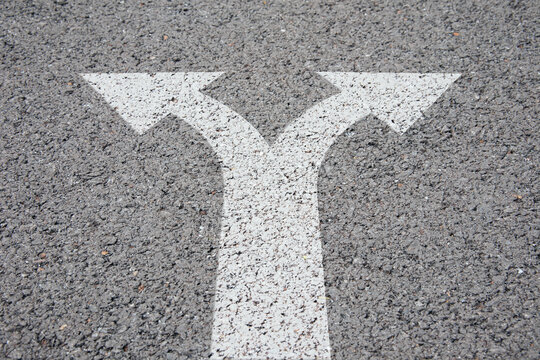 decision and choices concept. arrows separated on the road