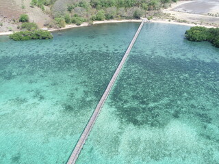 This bridge on the island of Manjarite and surrounded by a beautiful sea is in Labuan Bajo Indonesia