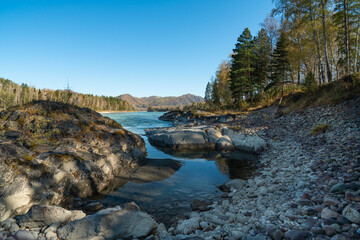 Mountain river on a background of autumn forest