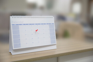 Calendar, Close-up red pin on blank desk calendar with office equipment concept of event planner or personal organization for business and appointment reminder and schedule planning.
