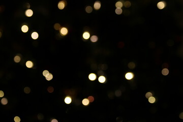 Sparkling Gold Lights Bokeh on Black Background