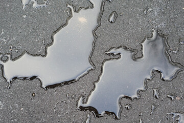 texture of water droplets on a black wet road