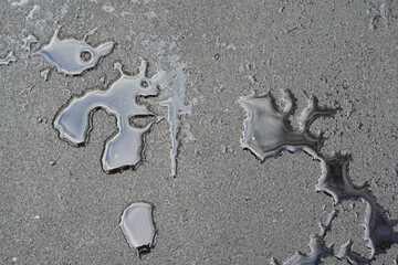 texture of water droplets on a black wet road