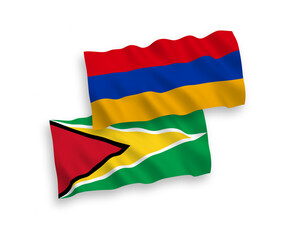 National vector fabric wave flags of Co-operative Republic of Guyana and Armenia isolated on white background. 1 to 2 proportion.