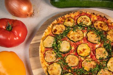 Vegetarian Provencal quiche recipe with vegetables, zucchini, tomato, pepper, onion, parsley. High quality photo