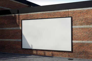 Blank Poster frame / Billboard / Display on an old factory brick wall - Mockup 

