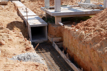 SELANGOR, MALAYSIA -JANUARY 22, 2021: Underground precast concrete box culvert drain under construction at the construction site. It is used to channel stormwater to prevent flash floods.  - obrazy, fototapety, plakaty