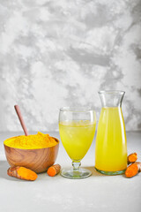 healthy turmeric drink on white table