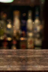 Empty wooden table top with lights bokeh on blur restaurant background