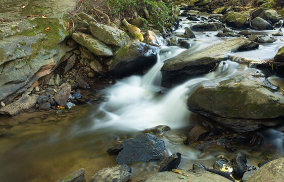 Stream cascading over boulders after sunset near Boone North Carolina