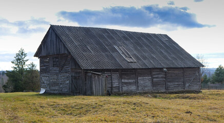 Fototapeta na wymiar Old , abandoned wood barn at late autumn in the Carpathian mountains, Romania.