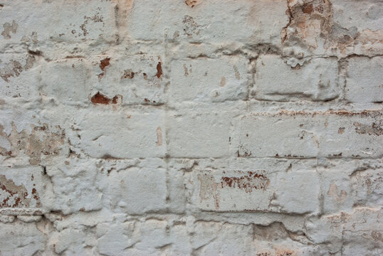 View of white brick weathered wall. Copyspace. Closeup
