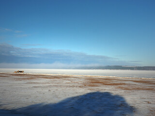 One winter frosty morning. Bank of the river. The river was covered with ice. Winter. Russia, Ural, Perm region.