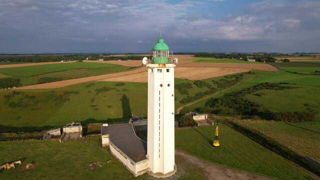 Aerial shot of the Antifer lighthouse from top of the lantern to global view from the sea and limestone cliffs.