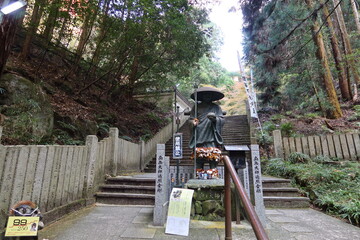 The image of Mukae-daishi in the precincts of Tanukidani-fudoumyouou-in Shrine in Kyoto City in Japan 日本の京都市にある狸谷不動明王院の境内にある迎え大師像