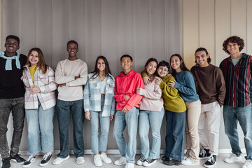 Happy multiracial group of teenagers having fun inside university - Young people lifestyle concept