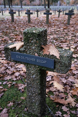 Lommel, Belgium - October 31, 2021: The largest German War Cemetery (Kriegsgraberstatte) and memorial site in Western Europe. Limburg Province. Autumn cloudy day. Selective focus.