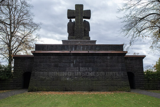 Lommel, Belgium - October 31, 2021: The largest German War Cemetery (Kriegsgraberstatte) and memorial site in Western Europe. Limburg Province. Autumn cloudy day. Selective focus.