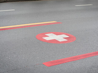 Special traffic lane symbols for emergency or ambulance vehicles on city streets.