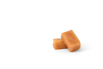 Caramel (toffee) candy isolated on white background.