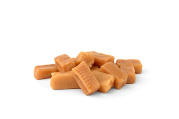 Pile of caramel (toffee) candy isolated on white background.