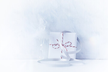 Christmas present on bright wooden background. Close up. Copy space.	