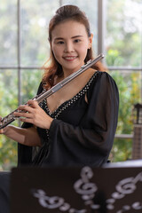 portrait of musician playing flute in studio © plo