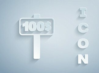 Paper cut Hand holding auction paddle icon isolated on grey background. Bidding concept. Auction competition. Hands rising signs with BID inscriptions. Paper art style. Vector