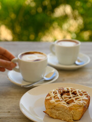 Breakfast two cups of coffee with taste.