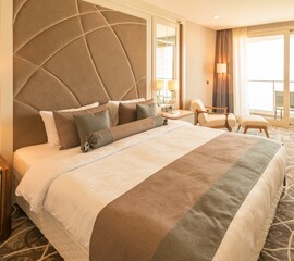 Modern hotel room with big bed