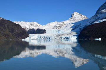Spegazzini glacier in a beautiful sunny day, showing vibrant blue ice in contrast with white snow, Argentina