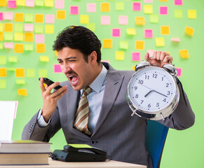 Businessman with many conflicting priorities in time management