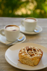 Breakfast time two cups of coffee with taste.