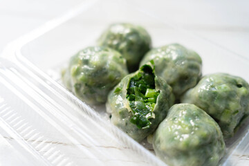 garlic chive dumplings in transparent plastic box