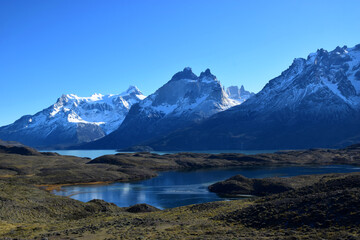 Torres del Paine in a beautiful sunny day showing contrast with the blue sky and white snowy mountain, Argentina Chile