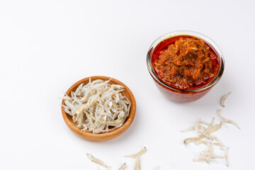 sambal ikan teri or anchovy chili is type of traditional cuisine from Indonesia. Indonesian chili sauce. Sambal ikan teri shoot on White Background. Negative Space. 