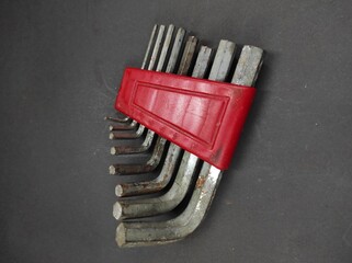 Photo of a set of hex keys isolated on a black background