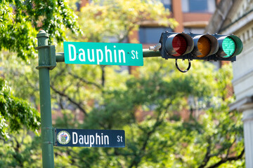 Mobile, USA with Dauphin street road sign closeup of old town in Alabama famous southern town city...
