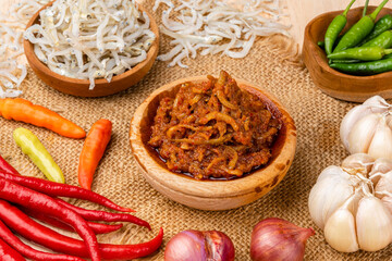 sambal ikan teri or anchovy chili is type of traditional cuisine from Indonesia. Indonesian chili sauce. Sambal ikan teri shoot on White Background. Negative Space. 