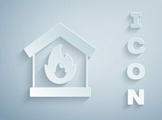 Paper cut Fire in burning house icon isolated on grey background. Paper art style. Vector