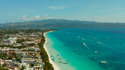 Naklejka na ściany i meble Tropical beach with tourists and clear blue sea, top view. Summer and travel vacation concept. Boracay, Philippines