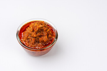 sambal ikan teri or anchovy chili is type of traditional cuisine from Indonesia. Indonesian chili sauce. Sambal ikan teri shoot on White Background. Negative Space. 