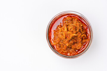 sambal ikan teri or anchovy chili is type of traditional cuisine from Indonesia. Indonesian chili sauce. Sambal ikan teri shoot on White Background. Negative Space. 
