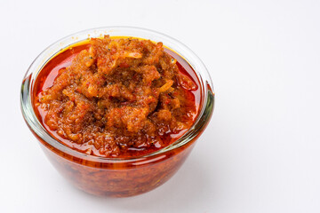 sambal ikan teri or anchovy chili is type of traditional cuisine from Indonesia. Indonesian chili sauce. Sambal ikan teri shoot on White Background. Negative Space. 
