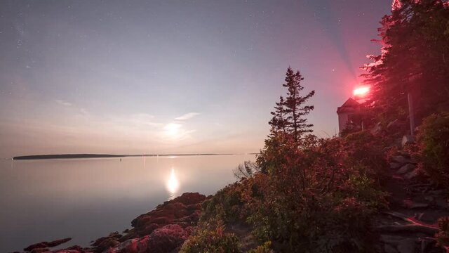 Moon setting and milky way rising at Bass Harbor Lighthouse in Acadia National Park, Maine
