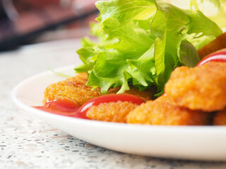 fish sticks chicken sticks breaded nuggets with ketchup and lettuce