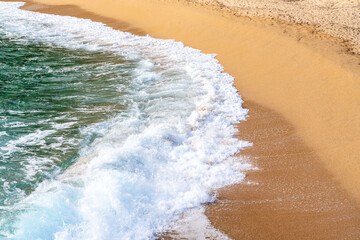 waves on the coastline of the beach in the day time, top angled view