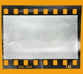 Start of 35mm negative filmstrip, first frame on yellow background, real scan of film material with...