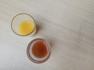 Jamu or herbal drink from Javanese culture, Indonesia. Each color made from different ingredient. Wooden background.